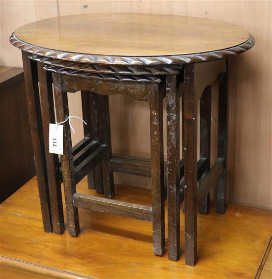 A nest of three oval mahogany tea tables